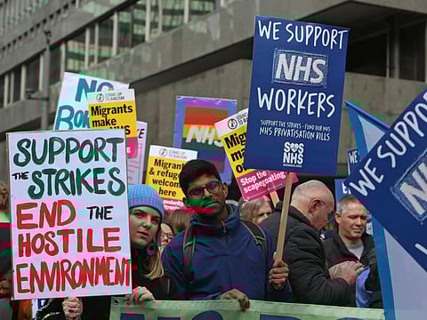 Demonstrators attend a protest rally in support of Britain's National Health Service (NHS) and proper pay for it's staff and workers, in central London on March 11, 2023.  