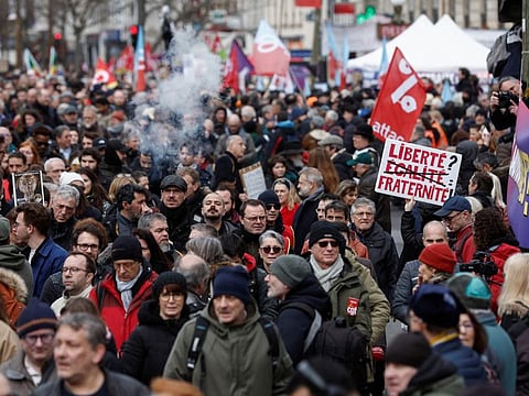 Demonstrators march against the government's pension reform plan in Paris, on March 11, 2023.  