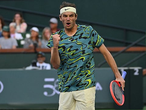 Taylor Fritz celebrates after defeating Ben Shelton in their second round match in the BNP Paribas Open at the Indian Wells Tennis Garden.