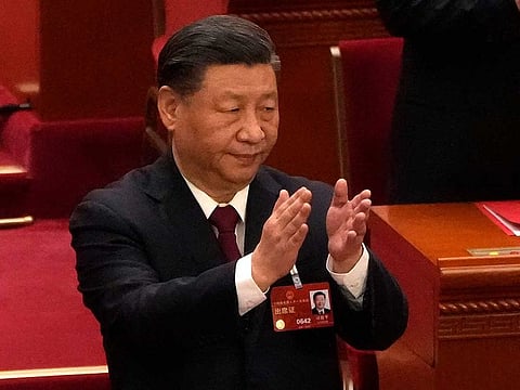 Chinese President Xi Jinping applauds at the closing ceremony for China's National People's Congress (NPC) at the Great Hall of the People in Beijing, Monday, March 13, 2023.