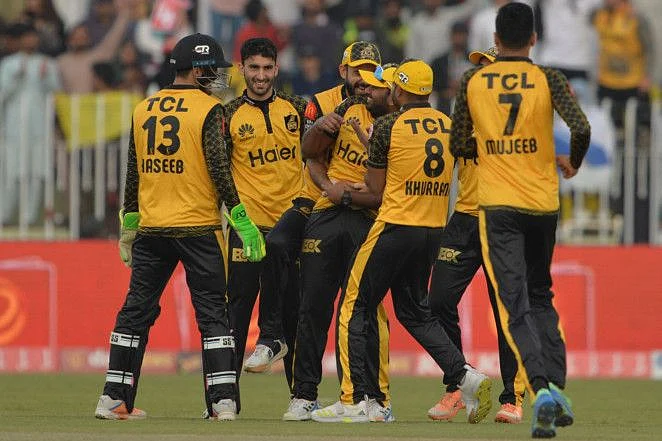 Peshawar Zalmi's players celebrate the wicket of Islamabad United's Asif Ali (not pictured) during the Pakistan Super League (PSL) Twenty20 cricket match at the Rawalpindi Cricket Stadium, in Rawalpindi.