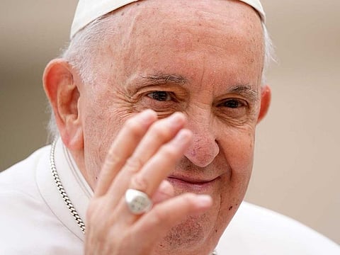 Pope Francis waves to faithful at the end of his weekly general audience in St. Peter's Square at The Vatican, Wednesday, March 8, 2023. 