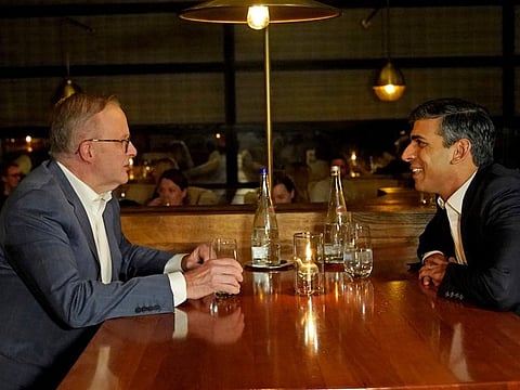 Britain's Prime Minister Rishi Sunak, right, speaks to Australian Prime Minister Anthony Albanese in the Lionfish seafood restaurant in San Diego Sunday, March 12, 2023.