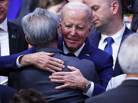 US President Joe Biden hugs an audience member after delivering remarks at the Boys and Girls Club of West San Gabriel Valley on March 14, 2023 in Monterey Park, California.  