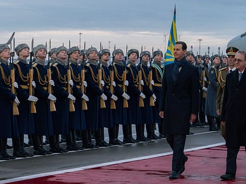 Syrian President Bashar Al Assad, left, and Mikhail Bogdanov,  Deputy Minister of Foreign Affairs of Russia and Special Representative of the President of Russia for the Middle East review an honour guard during a welcome ceremony upon Assad's arrival at Vnukovo airport in Moscow, on March 14, 2023. 