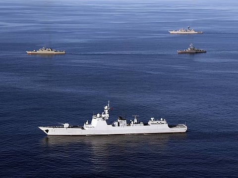 In this file photo provided by the Iranian Army, warships sail in the Sea of Oman during the second day of joint Iran, Russia and China naval war games on Dec. 28 2019.  