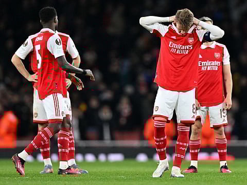 Arsenal's Martin Odegaard and teammates react after a penalty shoot-out in the UEFA Europa League round of 16 second-leg on Thursday.