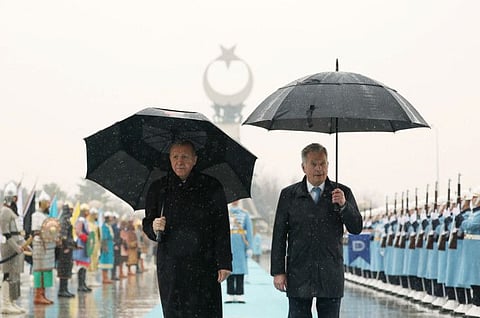 Turkey's President Tayyip Erdogan and Finland's President Sauli Niinisto review a guard of honour during a welcoming ceremony in Ankara, on March 17, 2023.  