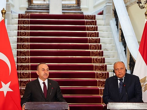 Turkish Foreign Minister Mevlut Cavusoglu and Egyptian Foreign Minister Sameh Shoukry attend a news conference in Cairo on March 18, 2023.  