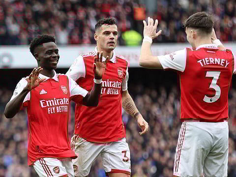 Arsenal's Bukayo Saka celebrates scoring their fourth goal with Kieran Tierney and Granit Xhaka.