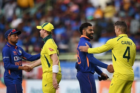 India's Virat Kohli (second right) and Kuldeep Yadav (left) shake hands with Australia's captain Steve Smith (second left) and Alex Carey at the end of the second one-day international (ODI) match at the Y.S. Rajasekhara Reddy Cricket Stadium in Visakhapatnam.
