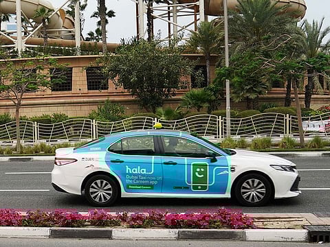 Archive image of an e-hail Hala taxi in Dubai 