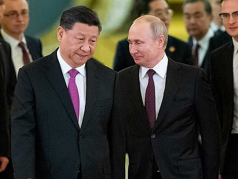 Chinese President Xi Jinping, left, and Russian President Vladimir Putin enter a hall for talks in the Kremlin in Moscow, Russia, June 5, 2019. 