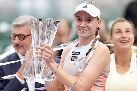 Elena Rybakina of Kazakhstan poses with the winner's trophy after defeating Aryna Sabalenka of Belarus during the Women's Final of the BNP Paribas Open at the Indian Wells Tennis Garden in Indian Wells, California.