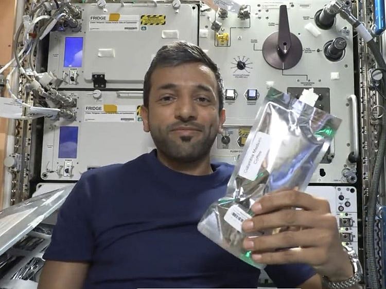 still-from-twitter-video-on-march-20-of-neyadi-with-coffee-pouch-on-ISS-1679310193610