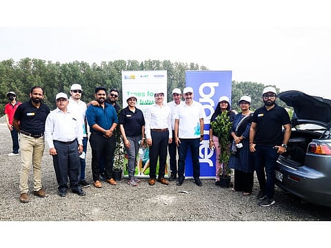 Almoe, Brother MEA and GEMS team at the tree planting drive at Tadweer