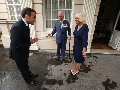 Britain's Prince Charles and Camilla, Duchess of Cornwall welcome French president Emmanuel Macron to Clarence House in London, Thursday June 18, 2020. Unrest in France is tarnishing the sheen of King Charles III’s first overseas trip as monarch.
