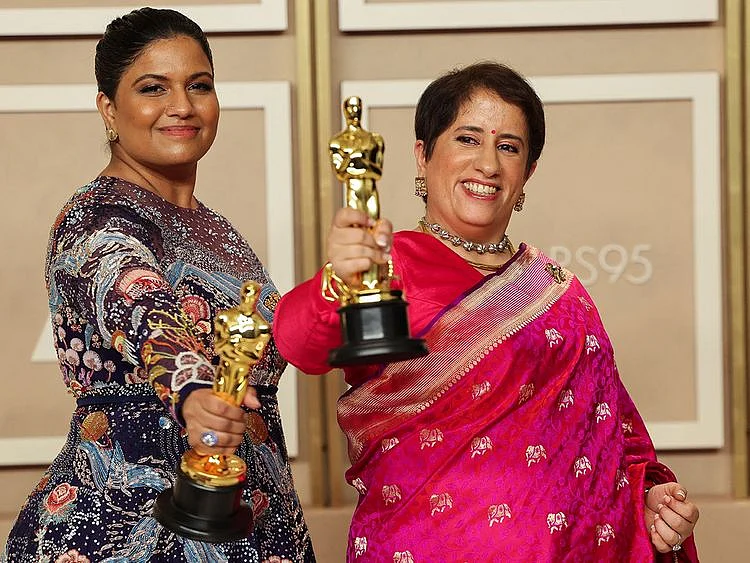 Kartiki Gonsalves and Guneet Monga pose with the Oscar for Best Documentary Short Film for "The Elephant Whisperers" in the Oscars photo room at the 95th Academy Awards in Hollywood, Los Angeles, California, U.S., March 12, 2023.