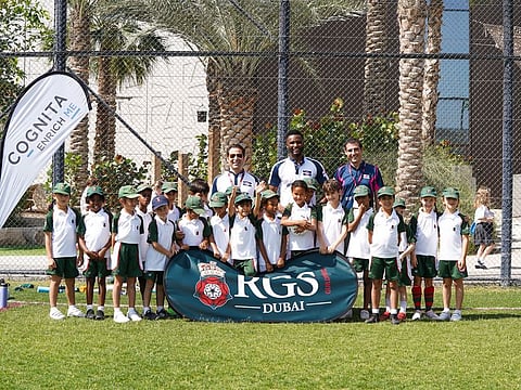Mimoun Assraoui,  John Obi Mikel, David Regueiro Santalla celebrating with RGS Pupils after the match” 