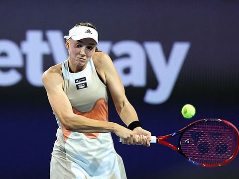 Elena Rybakina of Kazakhstan returns a serve to Paula Badosa of Spain during the Miami Open held at Hard Rock Stadium in Miami Gardens, Florida. 