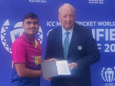 Aayan Khan receives the player of the match award for his unbeaten 96 and one wicket against PNG.