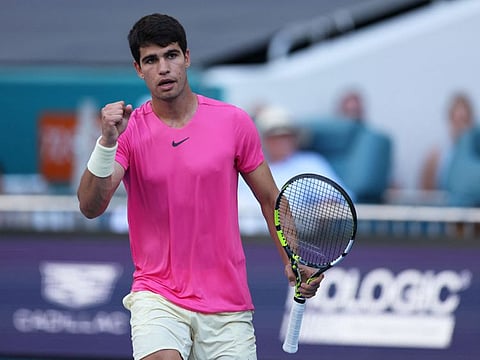 Carlos Alcaraz of Spain celebrates after beating Dusan Lajovic of Serbia in their third round match at Hard Rock Stadium in Miami Gardens, Florida.