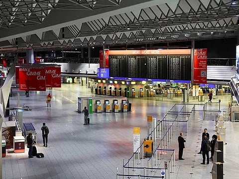 People stand inside the Frankfurt airport during a nationwide strike called by the German trade union Verdi over a wage dispute, in Frankfurt, Germany March 27, 2023. 