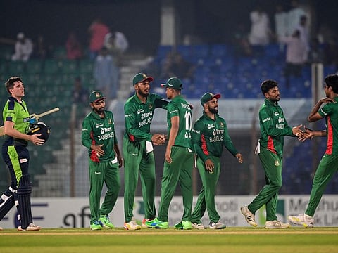 Bangladesh's players celebrate after their win in the first Twenty20 international cricket match against Ireland at the Zahur Ahmed Chowdhury Stadium in Chittagong.