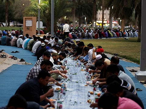Muslims are seen during iftar in Riyadh, on March 27, 2023. 