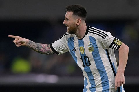 Argentina's forward Lionel Messi celebrates after scoring his 100th goal with the national team during the friendly against Curacao at the Madre de Ciudades stadium in Santiago del Estero, in northern Argentina.