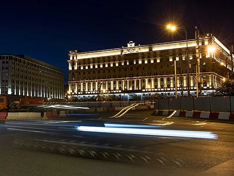A car passes the building of the Federal Security Service (FSB, Soviet KGB successor) in Lubyanskaya Square in Moscow, Russia, on Monday, July 24, 2017. Russia’s top security agency says a reporter for the Wall Street Journal has been arrested on espionage charges.