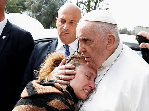 Serena Subania hugs Pope Francis while her husband, Matteo Rugghia, mourns after they lost their five-year-old child, as the Pope leaves Rome's Gemelli hospital in Rome, Italy, April 1, 2023. 