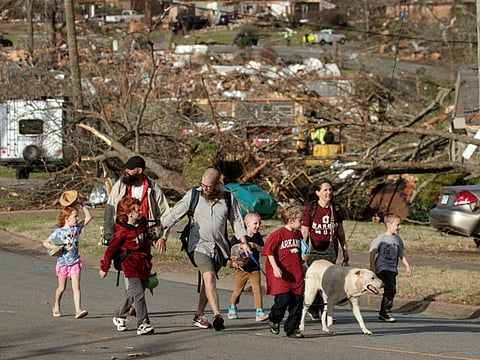 A family evacuates their Walnut Ridge neighbourhood on March 31, 2023 in Little Rock, Arkansas.  