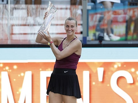 Petra Kvitova celebrates with the Butch Buchholz championship trophy after her match against Elena Rybakina in the women's singles final on day thirteen of the Miami Open at Hard Rock Stadium. 