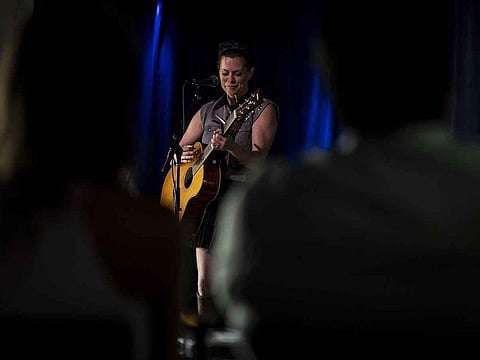 The singer and songwriter Coles Whalen performs for friends and family members at a small club. 