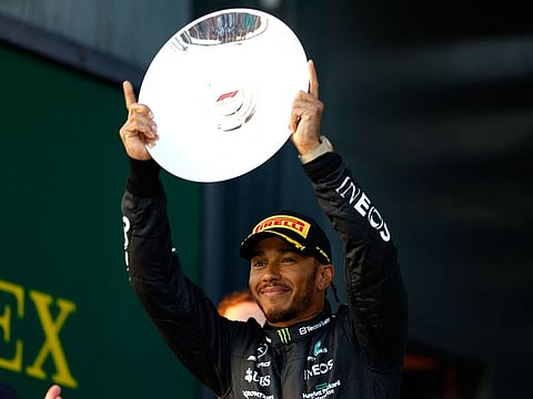 Mercedes' Lewis Hamilton celebrates his second-placed finish on the podium.