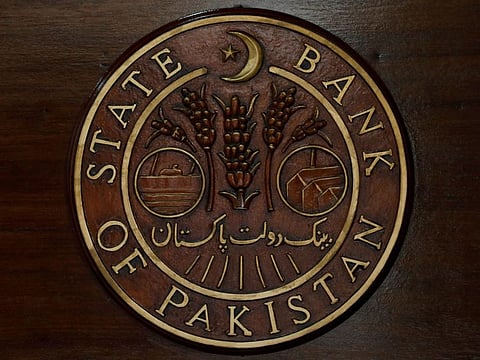 The logo of the State Bank of Pakistan (SBP) is pictured on a reception desk at the head office in Karachi, Pakistan.
