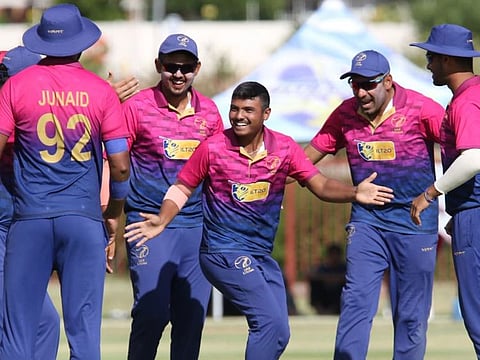UAE players celebrate a wicket during the Qualifier Playoff against Namibia.