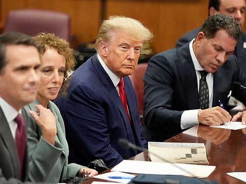 File photo: Donald Trump (c) appears in court with his legal team for an arraignment on charges stemming from his indictment by a Manhattan grand jury following a probe into hush money paid to porn star Stormy Daniels, in New York on April 4, 2023. 