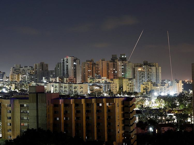 Streaks of lights are seen from Ashkelon, Israel as rockets are launched from the Gaza Strip April 6, 2023. 