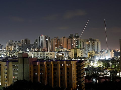Streaks of lights are seen from Ashkelon, Israel as rockets are launched from the Gaza Strip April 6, 2023. 