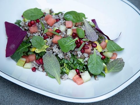 Lentil and quinoa salad with kale, mandarin and a pomegranate dressing