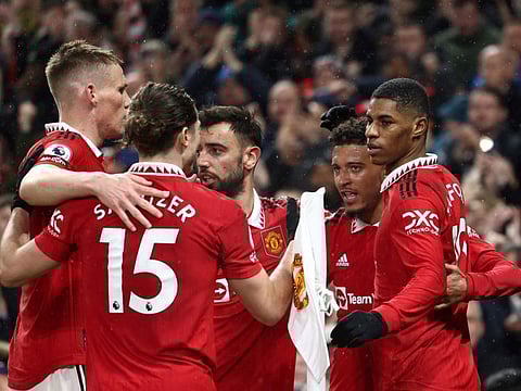 Manchester United's Marcus Rashford (right) celebrates after scoring his team's first goal during the English Premier League match against Brentford at Old Trafford on Wednesday.