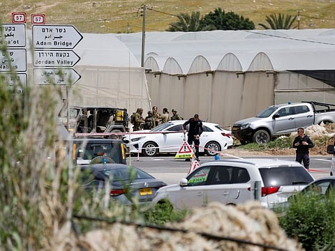 Israeli troops stand guard at a shooting attack scene in the Jordan Valley, in the Israeli-occupied West Bank April 7,2023.  