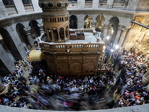 Christian worshippers attend Easter Sunday mass in the Church of the Holy Sepulchre in Jerusalem's Old City, April 9, 2023.