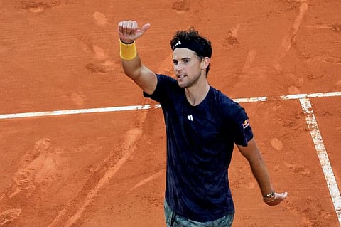 Austria's Dominic Thiem celebrates after winning against France's Richard Gasquet at the end of the Monte Carlo ATP Masters Series Tournament round of 64 tennis match at Monte Carlo.