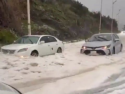 Vehicles stuck in the snow in Al Baha.