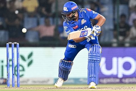 Mumbai Indians' Rohit Sharma watches the ball after playing a shot during the Indian Premier League match against Delhi Capitals at the Arun Jaitley Stadium in New Delhi.