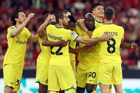 Inter Milan forward Romelu Lukaku (third right) celebrates scoring his team's second goal from the penalty spot during the UEFA Champions League quarter final first leg match against Benfica at the Luz stadium in Lisbon.
