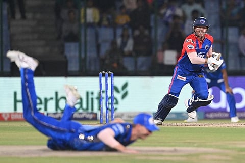 Delhi Capitals' David Warner watches the ball after playing a shot during the Indian Premier League match against Mumbai Indians at the Arun Jaitley Stadium in New Delhi.